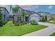 Charming two-story home with well-manicured lawn, mature landscaping, and a two car garage at 2781 Dolores Home Ave, Valrico, FL 33594