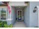 Charming entrance with a decorative wreath and an American flag adding a welcoming touch at 2781 Dolores Home Ave, Valrico, FL 33594
