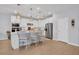 Well-lit kitchen featuring a center island with bar seating and stainless steel appliances at 2781 Dolores Home Ave, Valrico, FL 33594