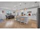 Bright open concept kitchen with stainless steel appliances, modern lighting, and a breakfast bar at 2781 Dolores Home Ave, Valrico, FL 33594