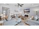 Cozy living room with comfortable seating, a modern fireplace, and plenty of natural light at 2781 Dolores Home Ave, Valrico, FL 33594