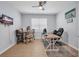 Functional office space with a modern desk, hardwood floors, and ample natural light at 2781 Dolores Home Ave, Valrico, FL 33594