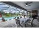 Relaxing screened-in pool with dining and lounging area overlooking the spacious backyard at 2781 Dolores Home Ave, Valrico, FL 33594
