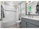 Bathroom with tub and shower, modern vanity and sink at 28512 Picana Ln, Wesley Chapel, FL 33543