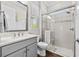 Bathroom featuring an elegant shower with glass enclosure, white subway tile, and a shower niche at 28512 Picana Ln, Wesley Chapel, FL 33543