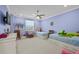 Spacious bedroom featuring twin beds, ceiling fan and ample natural light at 28512 Picana Ln, Wesley Chapel, FL 33543