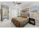 Bedroom with queen size bed and view of pool at 28512 Picana Ln, Wesley Chapel, FL 33543