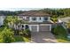 Beautiful two-story home featuring a tile roof, manicured lawn and a two car garage at 28512 Picana Ln, Wesley Chapel, FL 33543