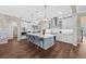 Open kitchen featuring a large center island, modern appliances, and ample cabinet space at 28512 Picana Ln, Wesley Chapel, FL 33543