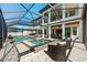 Sparkling pool and spa enclosed within screened lanai of this luxurious home at 28512 Picana Ln, Wesley Chapel, FL 33543