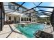 Resort-style pool with fire pit, outdoor kitchen and stunning views of the backyard at 28512 Picana Ln, Wesley Chapel, FL 33543