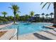 Community pool featuring a water slide, lounge chairs and plenty of space for a relaxing day at 28512 Picana Ln, Wesley Chapel, FL 33543