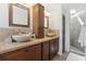 Stylish bathroom with double sinks, granite countertop, and tile backsplash at 2914 W Gandy Blvd # C, Tampa, FL 33611
