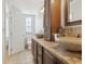 Elegant bathroom features double sinks, granite countertop, and tile floors at 2914 W Gandy Blvd # C, Tampa, FL 33611
