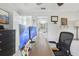 Bedroom or office space featuring two computer monitors, a desk, and a glimpse of the bathroom at 2914 W Gandy Blvd # C, Tampa, FL 33611