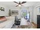 Bedroom featuring a daybed, desk setup with dual monitors, and a window view at 2914 W Gandy Blvd # C, Tampa, FL 33611