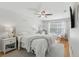 Bright bedroom featuring a ceiling fan, wood floors, and a plush rug at 2914 W Gandy Blvd # C, Tampa, FL 33611