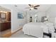 Bright bedroom with ensuite bathroom featuring tile floors and modern ceiling fan at 2914 W Gandy Blvd # C, Tampa, FL 33611