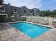 Inviting community pool area featuring lounge chairs, well maintained brick pavers and lush landscaping at 2914 W Gandy Blvd # C, Tampa, FL 33611