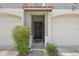 Inviting entryway with a decorative wreath on the door and manicured bushes for added curb appeal at 2914 W Gandy Blvd # C, Tampa, FL 33611