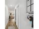 Bright hallway with wood floors leading into a cozy living space at 2914 W Gandy Blvd # C, Tampa, FL 33611