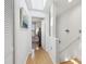 Bright hallway with hardwood floors, skylight and staircase to the right at 2914 W Gandy Blvd # C, Tampa, FL 33611