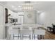 Well-lit kitchen area with marble countertops, white cabinetry, and barstool seating at 2914 W Gandy Blvd # C, Tampa, FL 33611
