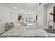 Open living area featuring a comfortable sectional sofa, glass table, and access to an outdoor patio at 2914 W Gandy Blvd # C, Tampa, FL 33611