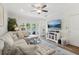 Inviting living room featuring a sectional sofa, TV, and access to the patio through glass doors at 2914 W Gandy Blvd # C, Tampa, FL 33611