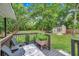 Back deck overlooking large green backyard with shed and privacy fence at 316 Jenkins Ave, Brooksville, FL 34604