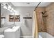 Bathroom featuring a shower-tub combination with neutral tile and a vanity with sink at 316 Jenkins Ave, Brooksville, FL 34604