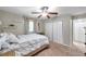 Spacious bedroom with soft carpeting, shelving, and double door closets that offer ample storage solutions at 316 Jenkins Ave, Brooksville, FL 34604