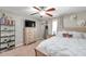 Light filled bedroom with ceiling fan, dresser, and a decorative shelf for an enjoyable aesthetic at 316 Jenkins Ave, Brooksville, FL 34604