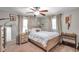 Comfortable bedroom featuring a ceiling fan, light wood furnishings and a decorative western theme at 316 Jenkins Ave, Brooksville, FL 34604