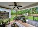 Inviting backyard deck area with comfortable seating and a view of the lush green yard at 316 Jenkins Ave, Brooksville, FL 34604