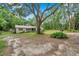 Beautiful property with a lush lawn and mature trees creating a serene setting at 316 Jenkins Ave, Brooksville, FL 34604
