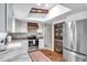 Modern kitchen with stainless steel appliances, pantry, and a stylish breakfast bar at 316 Jenkins Ave, Brooksville, FL 34604