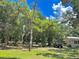 Heavily wooded land with existing home, outbuilding and vehicle is ripe for redevelopment at 316 Jenkins Ave, Brooksville, FL 34604