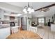 Open-concept home blends a remodeled kitchen, a living room with a stone fireplace, and a dining area at 316 Jenkins Ave, Brooksville, FL 34604