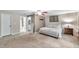 Cozy main bedroom with plush carpeting, neutral walls, and an ensuite bathroom at 316 Jenkins Ave, Brooksville, FL 34604
