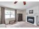 Bright main bedroom featuring a fireplace, neutral colors, and plush carpeting at 316 Jenkins Ave, Brooksville, FL 34604