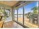 Interior view showing access to wooden deck, featuring great water views and natural lighting at 3285 Minnow Creek Dr, Hernando Beach, FL 34607