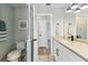 Bathroom with white cabinets, marble countertops, modern fixtures, and neutral paint at 3285 Minnow Creek Dr, Hernando Beach, FL 34607