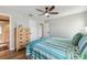 Bedroom with hardwood floors, ceiling fan, and ensuite bathroom at 3285 Minnow Creek Dr, Hernando Beach, FL 34607