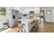 Modern kitchen with stainless steel appliances, quartz countertops, and an island with seating at 3285 Minnow Creek Dr, Hernando Beach, FL 34607