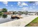 This waterfront property features a private dock on a calm waterway under a sunny sky at 3285 Minnow Creek Dr, Hernando Beach, FL 34607
