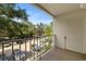 Relaxing balcony with views of trees, parking, and a steel railing at 3325 Bayshore Blvd # C36, Tampa, FL 33629