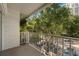 Relaxing balcony with views of trees, parking, and a white railing at 3325 Bayshore Blvd # C36, Tampa, FL 33629