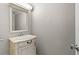 Small powder room featuring a decorative vanity, mirror, and neutral tones at 3325 Bayshore Blvd # C36, Tampa, FL 33629