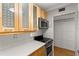 Kitchen featuring stainless steel oven, microwave, quartz counters and wooden cabinets at 3325 Bayshore Blvd # C36, Tampa, FL 33629